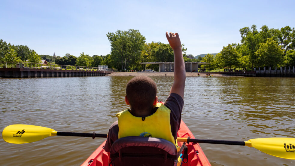 Photo of a boy kayaking by Sahar Coston-Hardy.