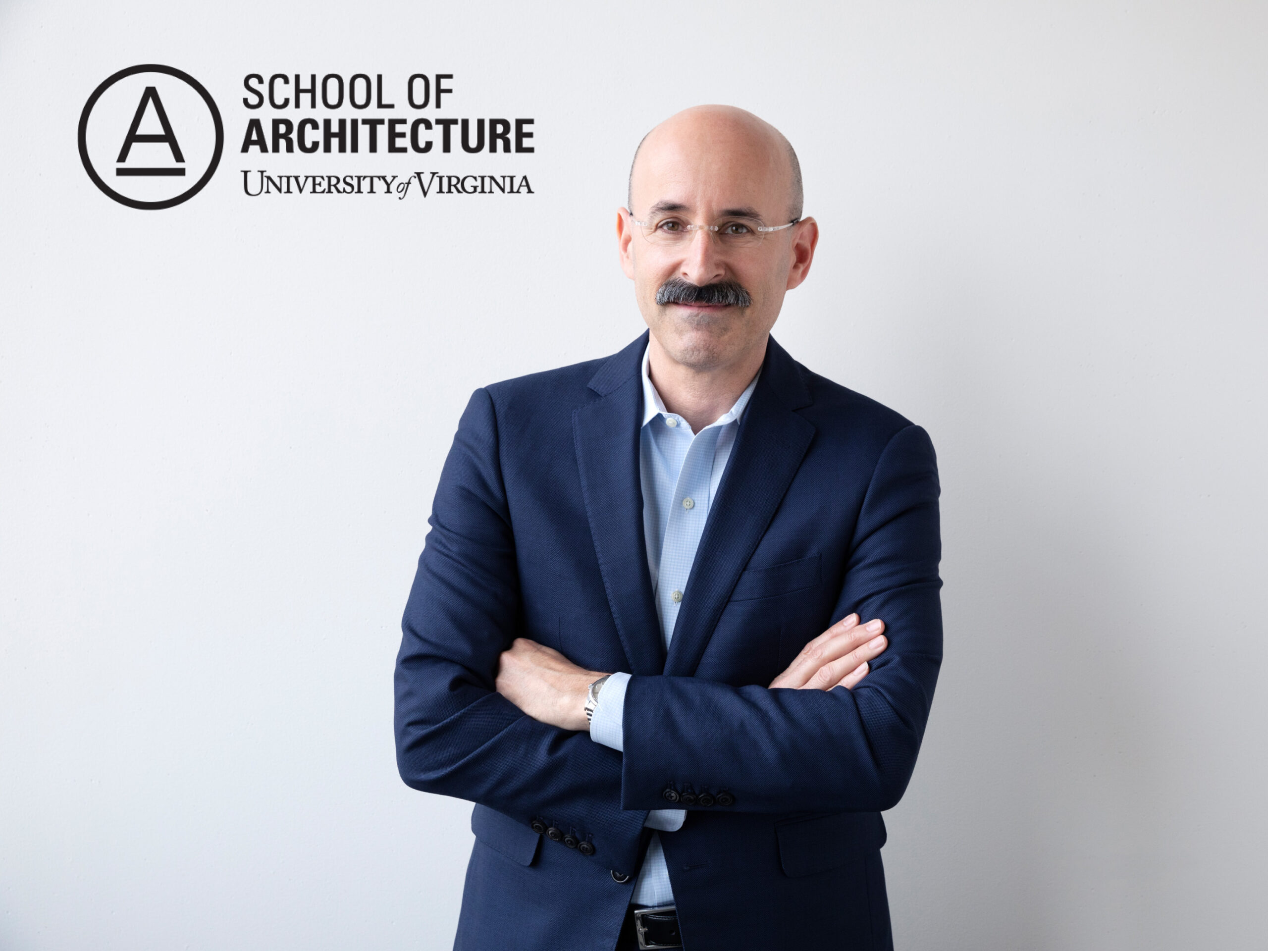 Headshot of Adam Yarinsky against white background with logo of UVA School of Architecture logo in the upper left corner