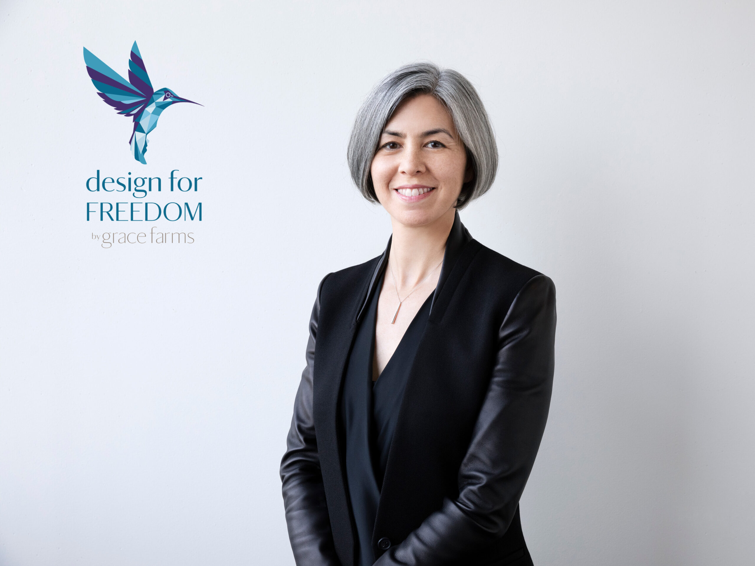 Headshot of Kim Yao against white background. "Design for Freedom Grace Farms" hummingbird logo in upper left corner.